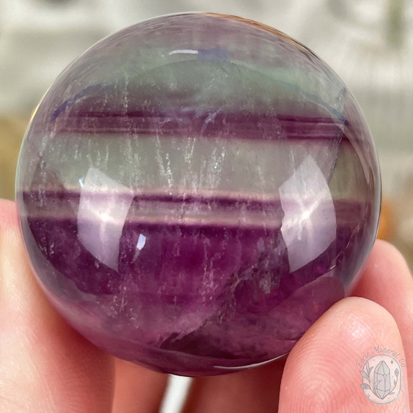 40mm Polished Rainbow Fluorite Sphere with Flash