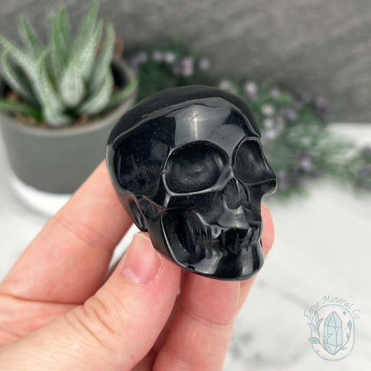 Polished Silver Sheen Obsidian Skull Carving