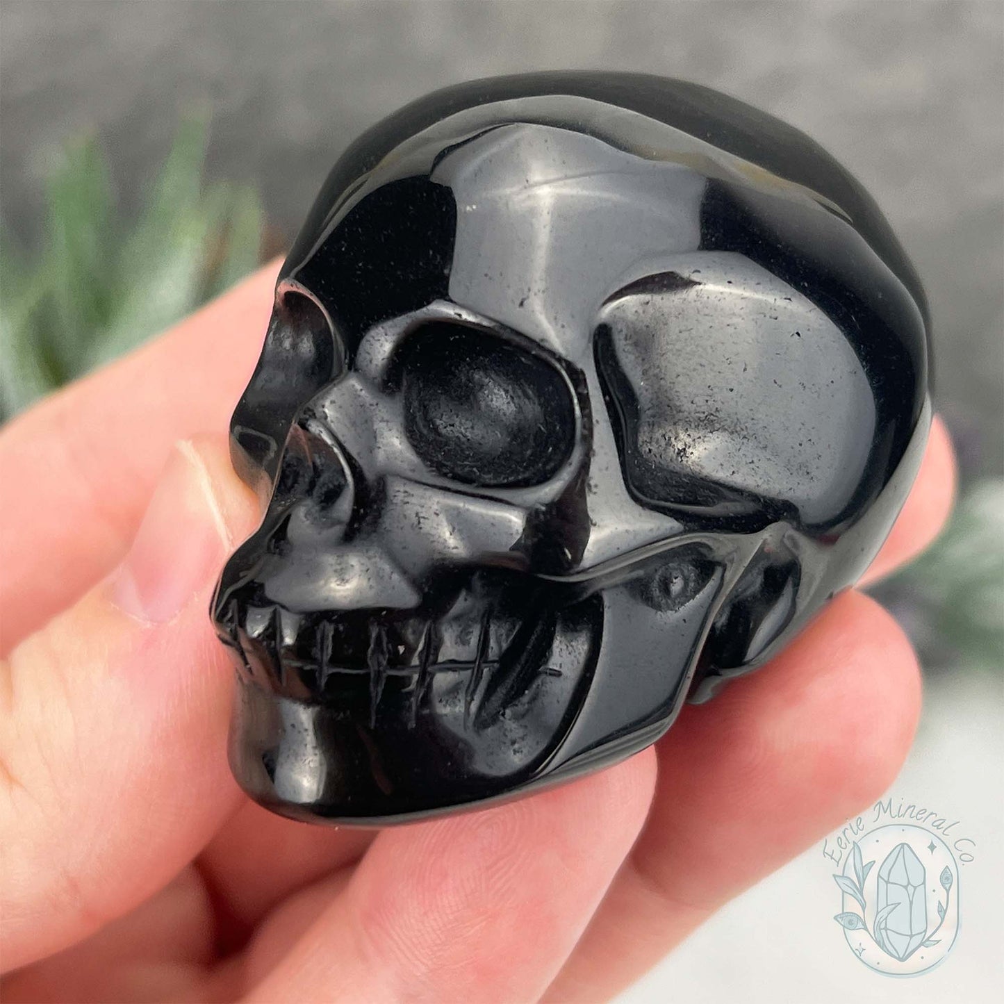 Polished Silver Sheen Obsidian Skull Carving