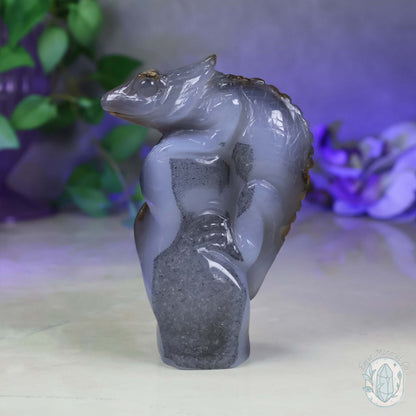 Polished Agate Lizard Perched on Rock Carving