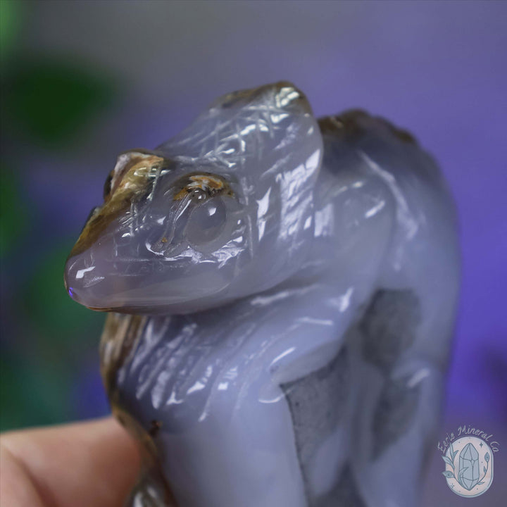 Polished Agate Lizard Perched on Rock Carving