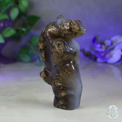 Polished Agate Lizard Perched on Rock Carving