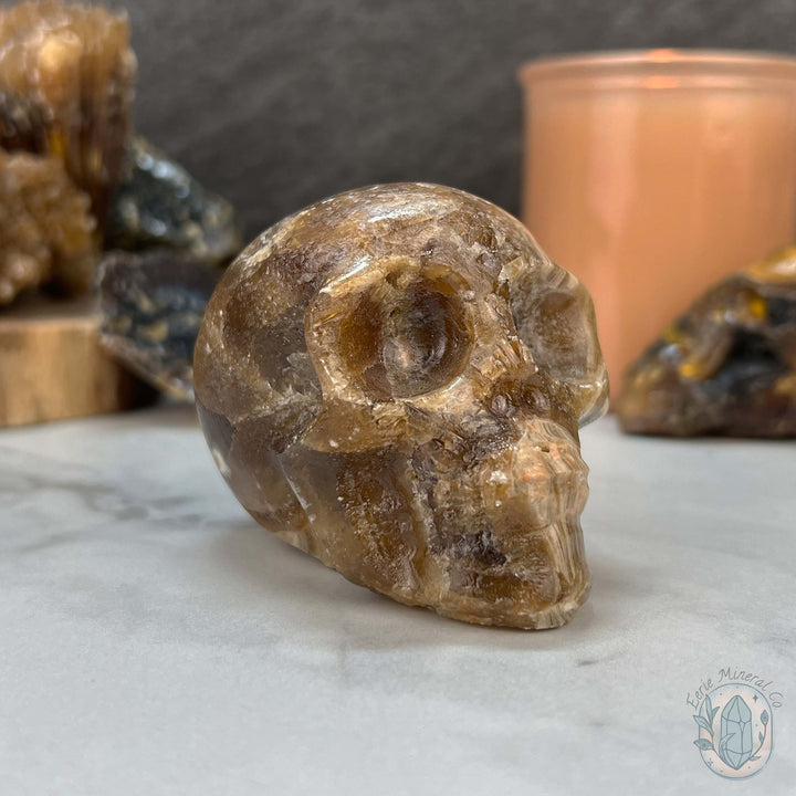 Polished Druzy Amber Calcite Skull Carving