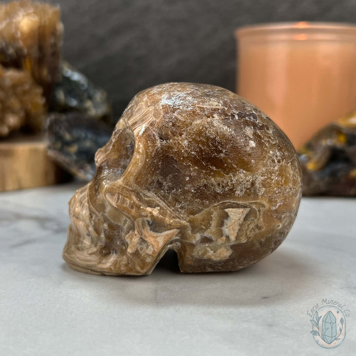 Polished Druzy Amber Calcite Skull Carving