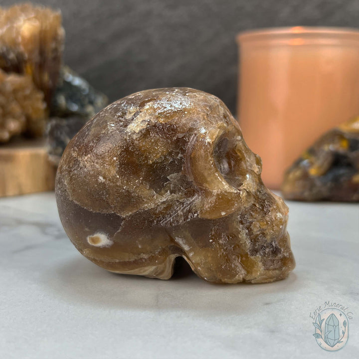 Polished Druzy Amber Calcite Skull Carving