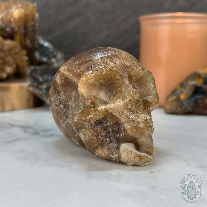 Polished Druzy Amber Calcite Skull Carving