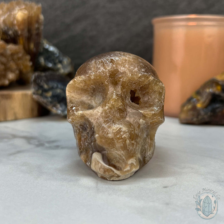 Polished Druzy Amber Calcite Skull Carving