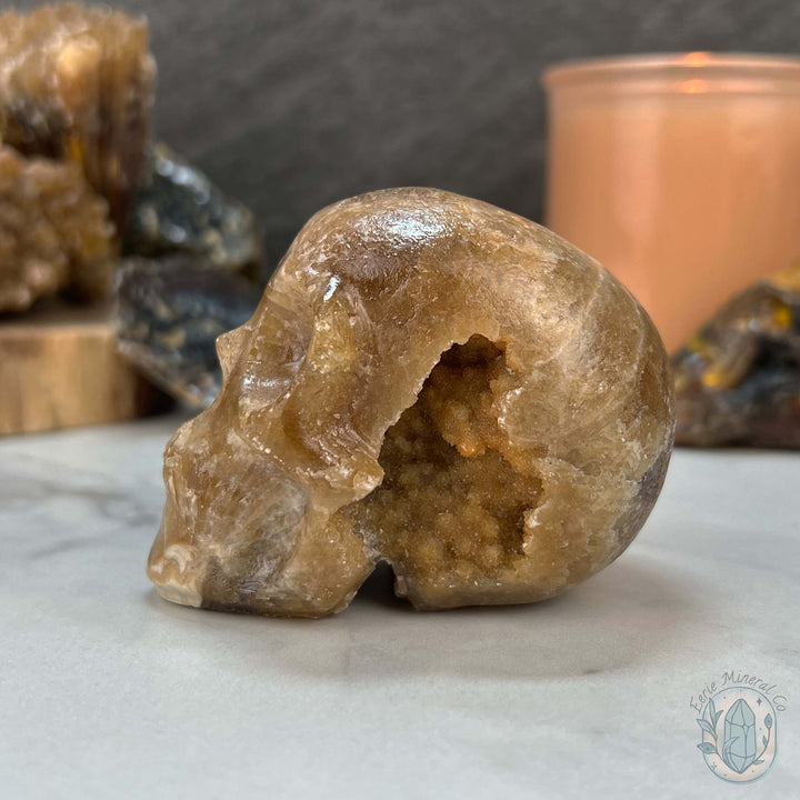 Polished Druzy Amber Calcite Skull Carving