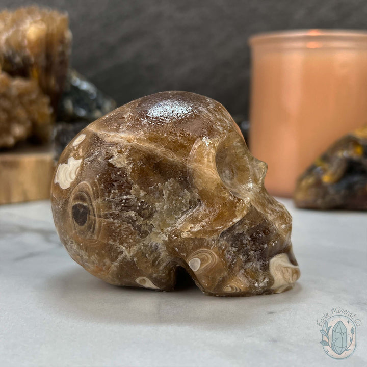 Polished Druzy Amber Calcite Skull Carving