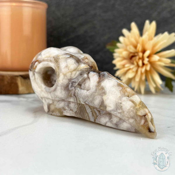 Polished Flower Agate Raven Skull Carving