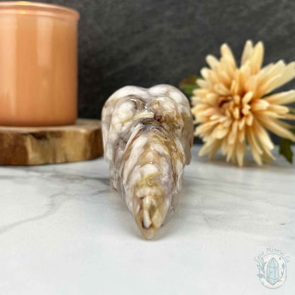 Polished Flower Agate Raven Skull Carving
