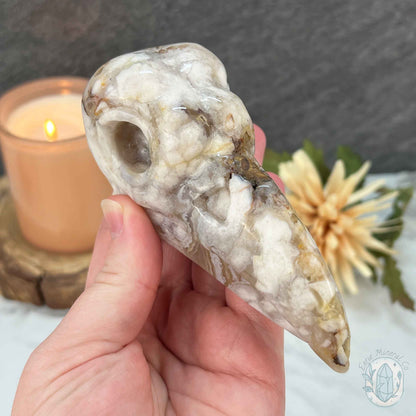 Polished Flower Agate Raven Skull Carving