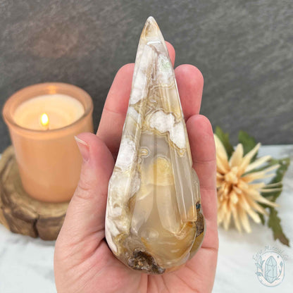 Polished Flower Agate Raven Skull Carving