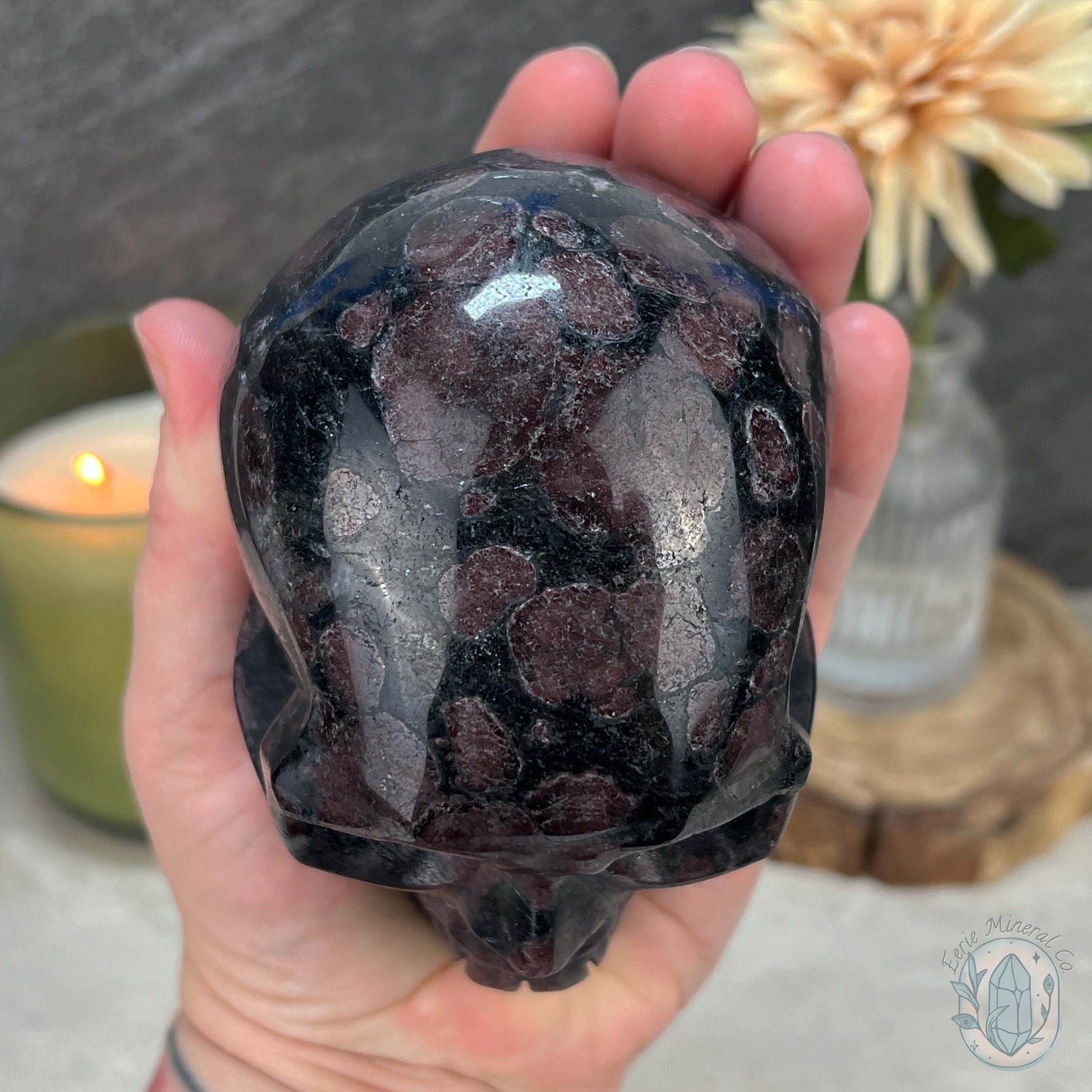 Polished Arfvedsonite and Garnet Firework Skull Carving