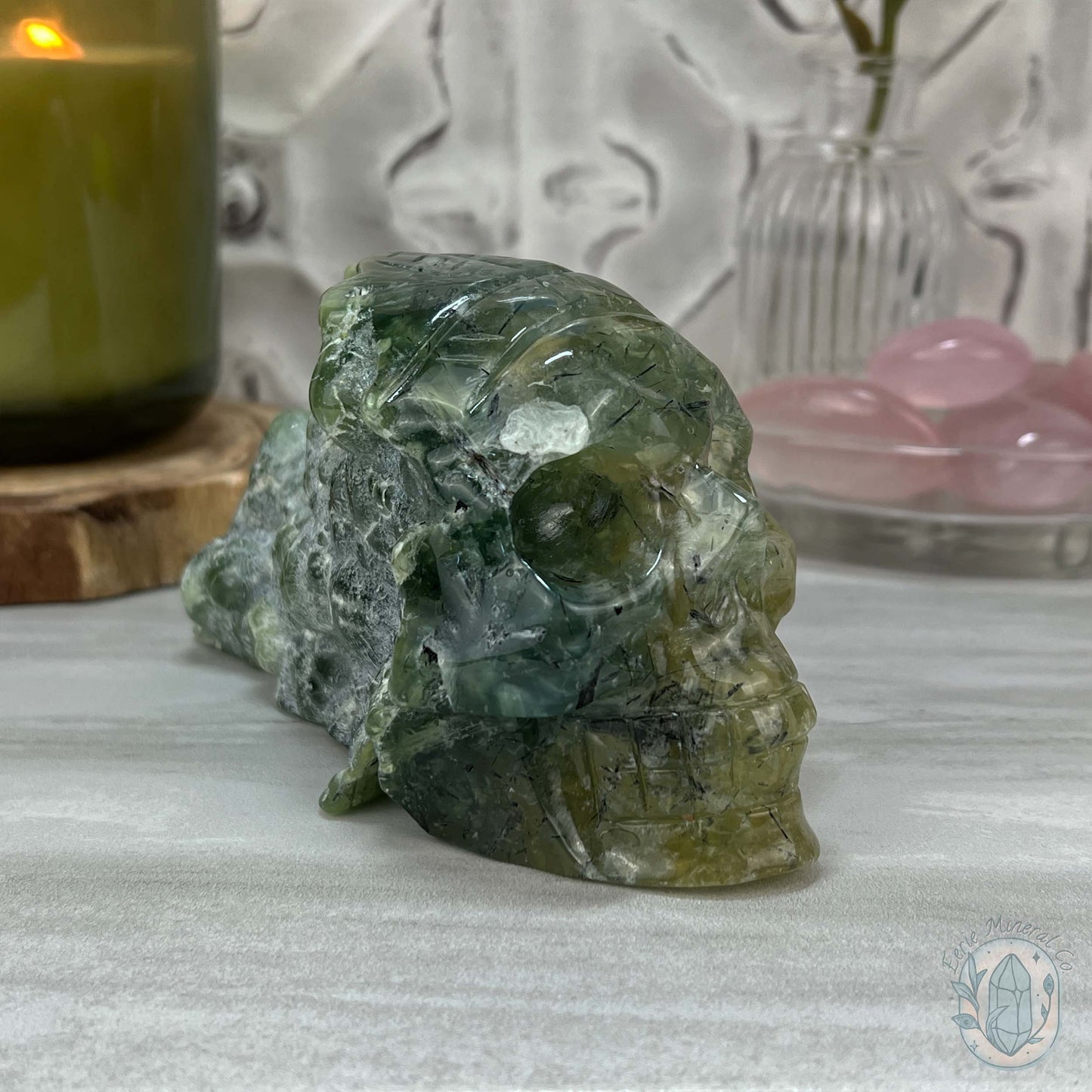 Polished Prehnite Skull with Headdress Carving