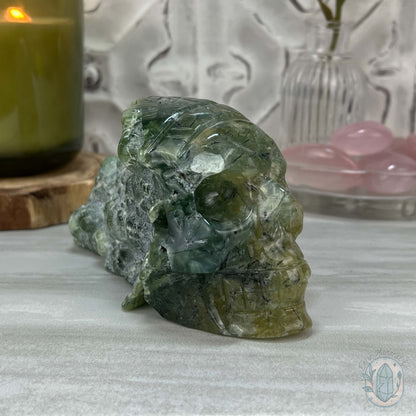 Polished Prehnite Skull with Headdress Carving
