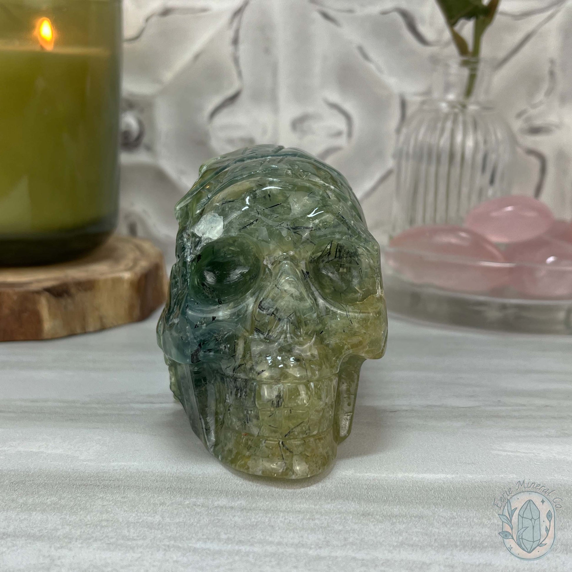 Polished Prehnite Skull with Headdress Carving