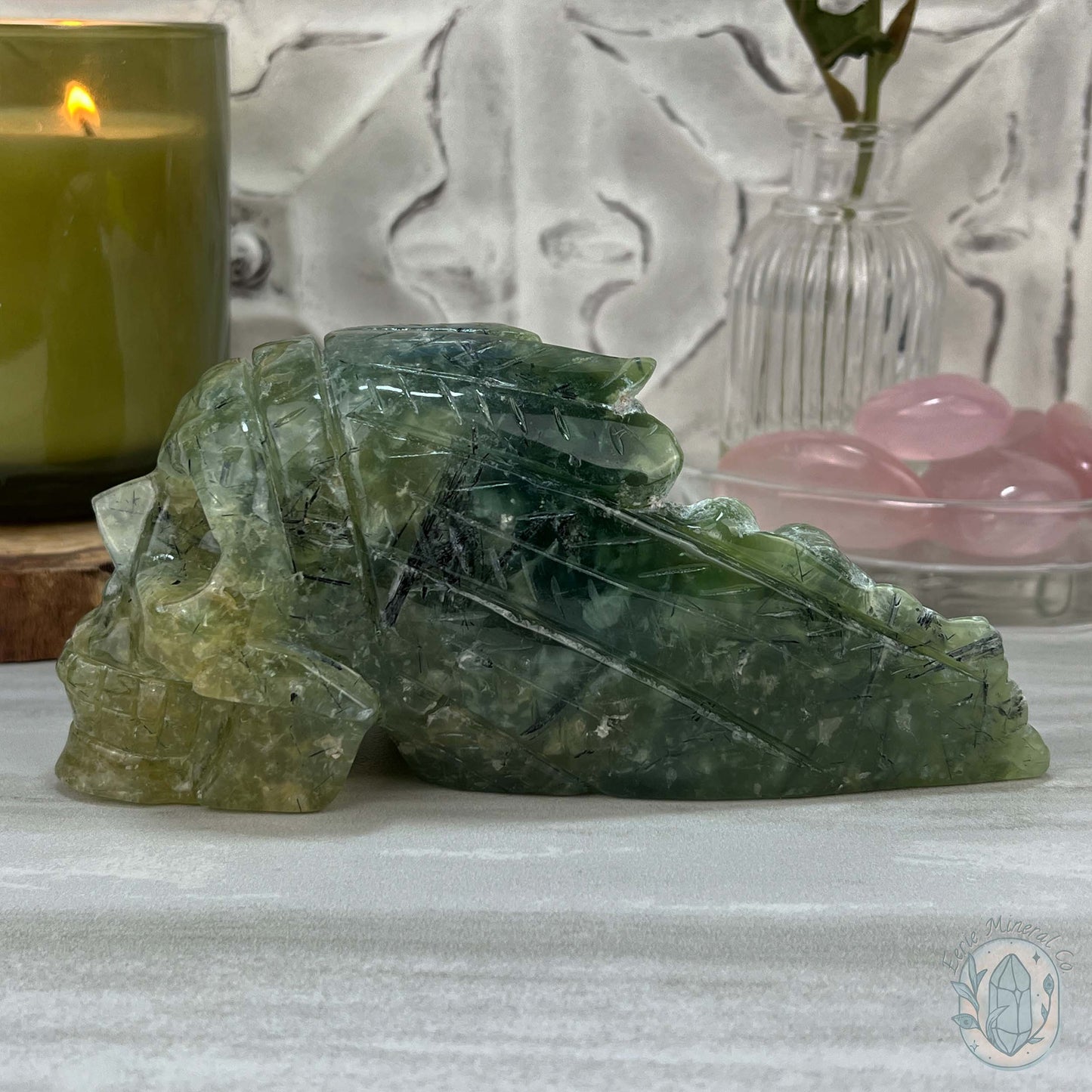 Polished Prehnite Skull with Headdress Carving