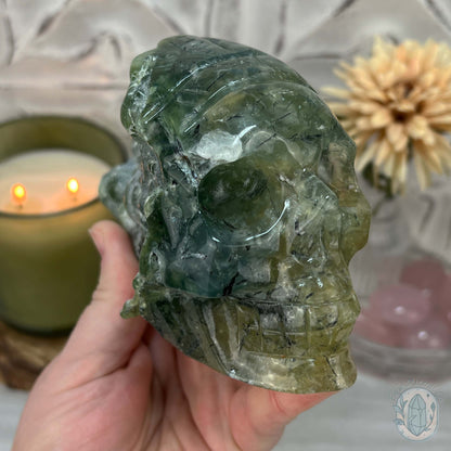 Polished Prehnite Skull with Headdress Carving