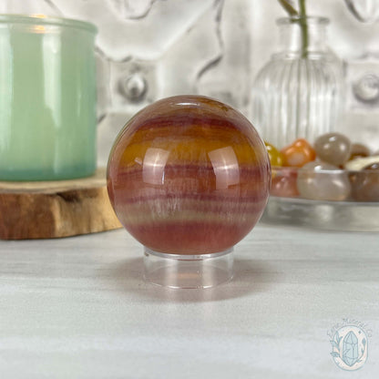 56mm Polished Yellow and Purple Fluorite Sphere with Flash