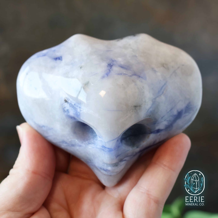 Sodalite Alien head carving on display stand - uv reactive