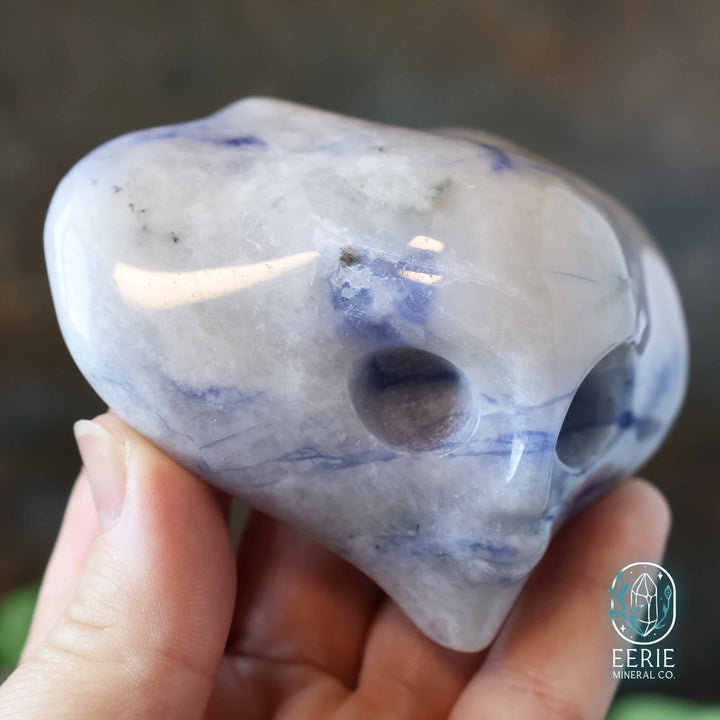 Sodalite Alien head carving on display stand - uv reactive