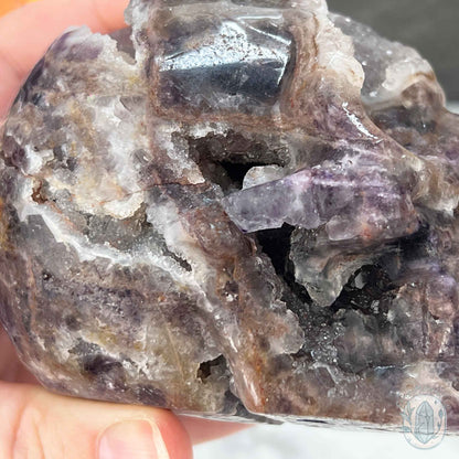 Polished Sphalerite with Purple Fluorite Skull Carving