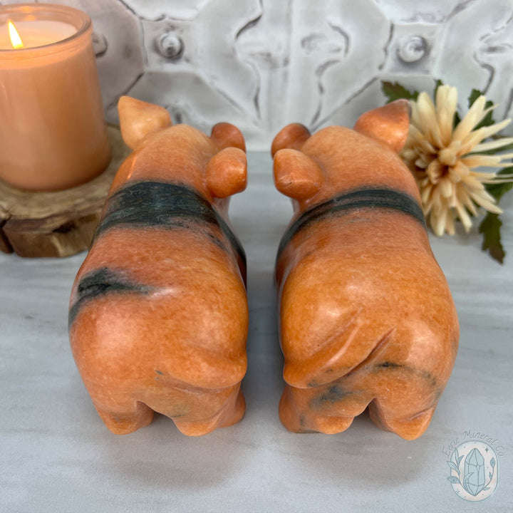 Polished Pair of Sunstone with Hornblende Pig Carvings