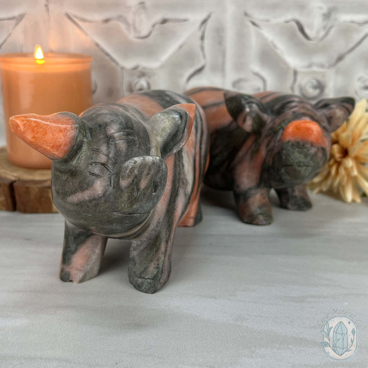 Polished Pair of Sunstone with Hornblende Pig Carvings