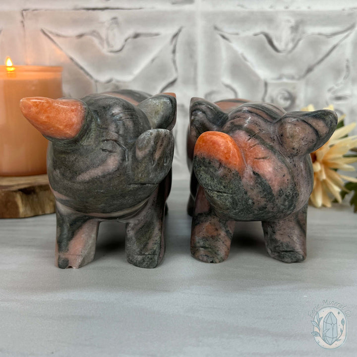 Polished Pair of Sunstone with Hornblende Pig Carvings