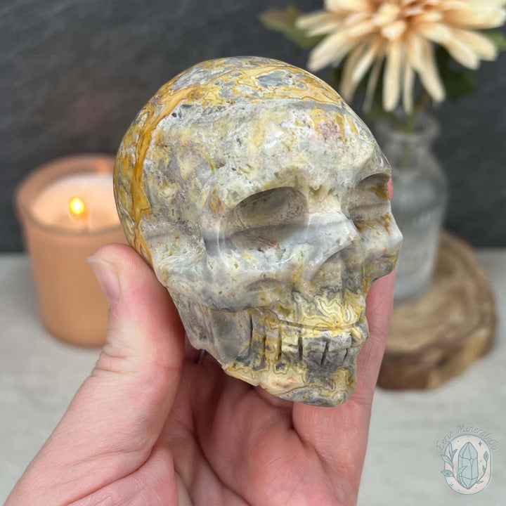 3.10" Polished Crazy Lace With Quartz Skull Carving