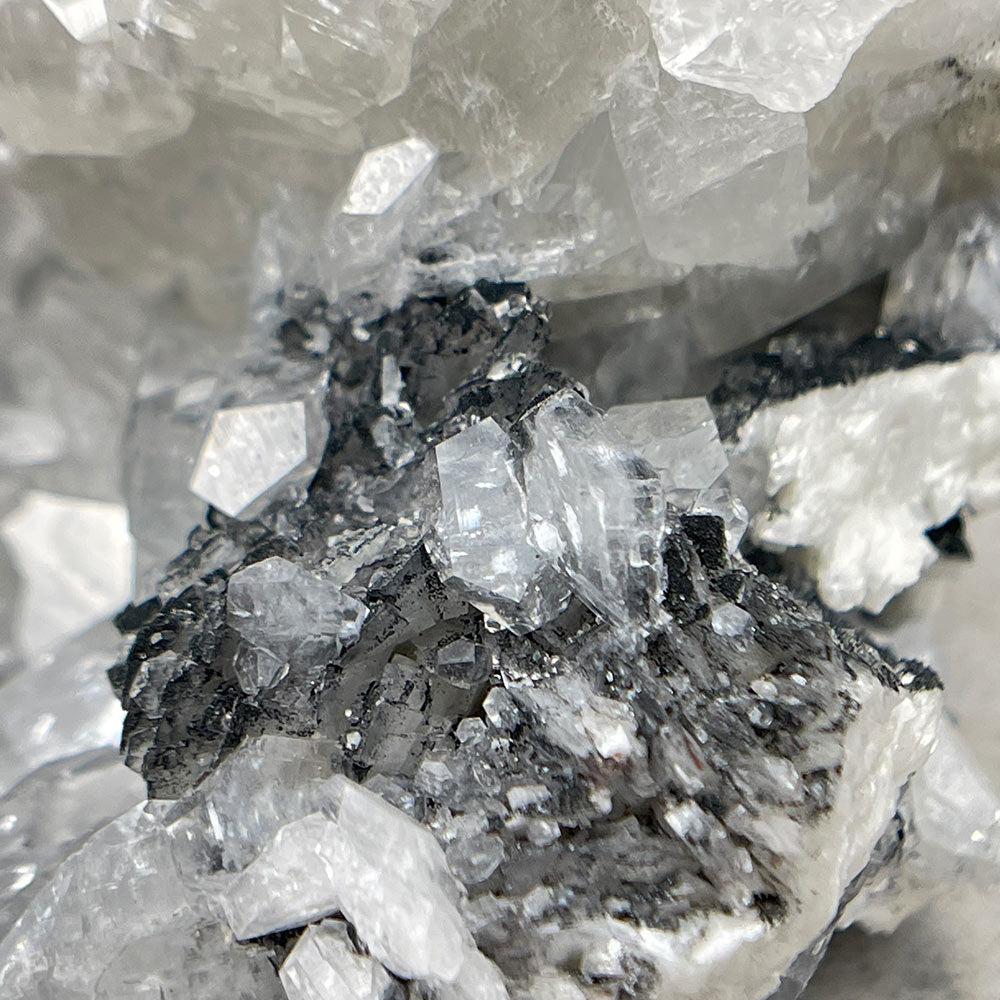 Apophyllite crystal with black chalcedony