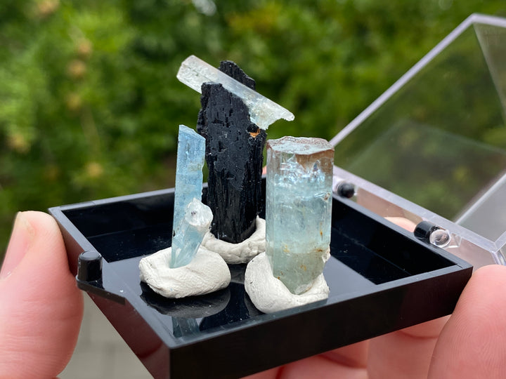 Aquamarine specimen group (3) with black tourmaline (1). This specimen group comes from The Republic of Namibia, Southern Africa.