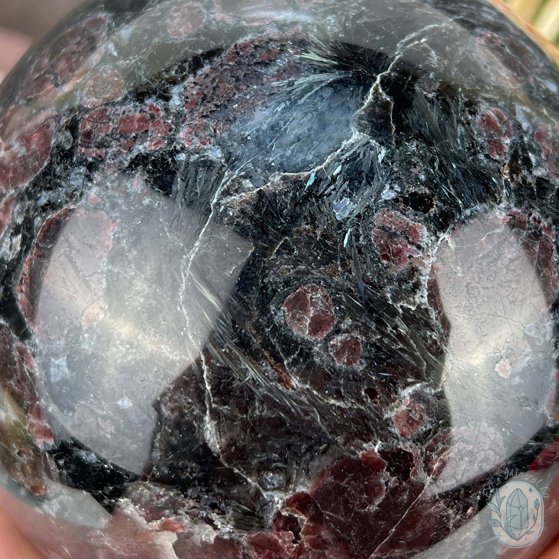 101mm Polished Arfvedsonite and Garnet Firework Sphere