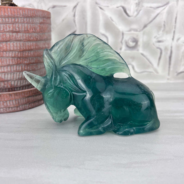 Polished Green Fluorite Unicorn Carving with Natural Wood Base