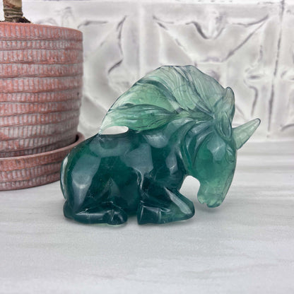 Polished Green Fluorite Unicorn Carving with Natural Wood Base