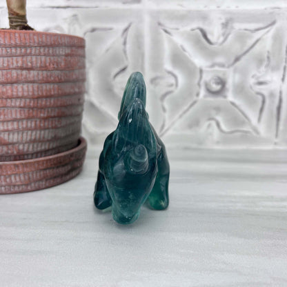 Polished Green Fluorite Unicorn Carving with Natural Wood Base