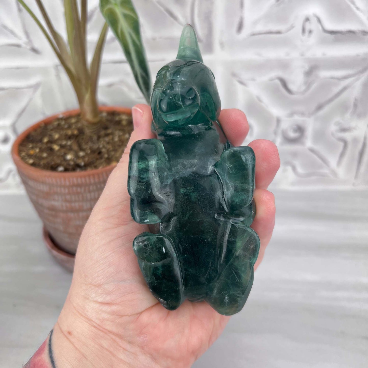 Polished Green Fluorite Unicorn Carving with Natural Wood Base