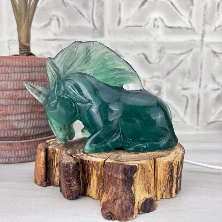 Polished Green Fluorite Unicorn Carving with Natural Wood Base