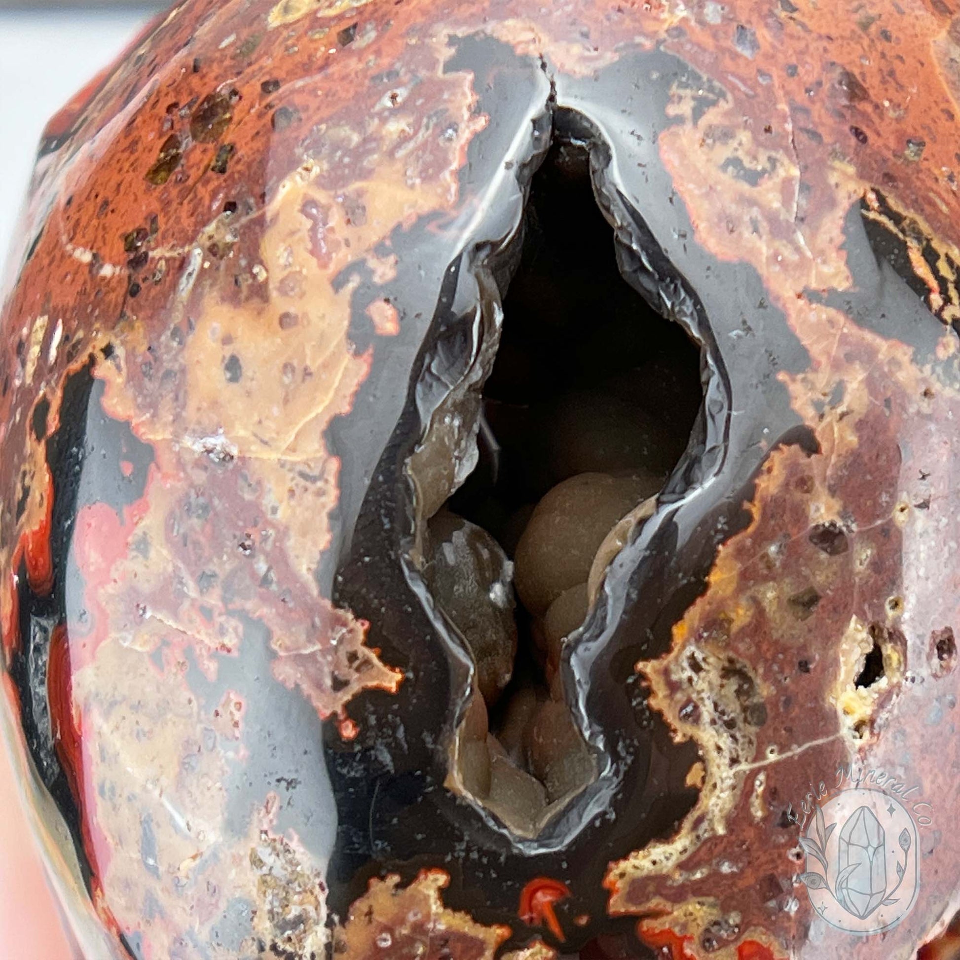 Polished Orrelanite Red Fox Agate Skull Carving
