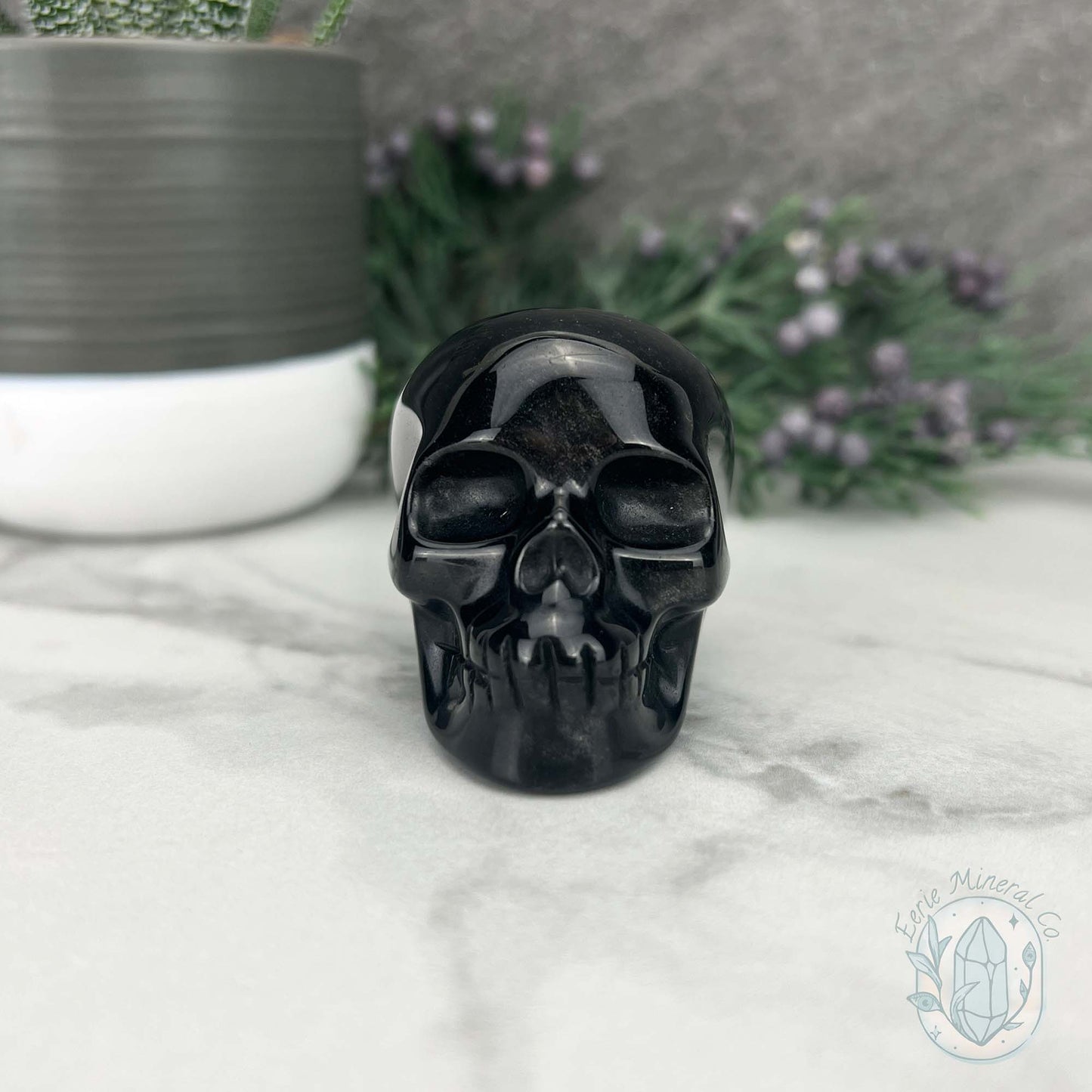 Polished Silver Obsidian Skull Carving