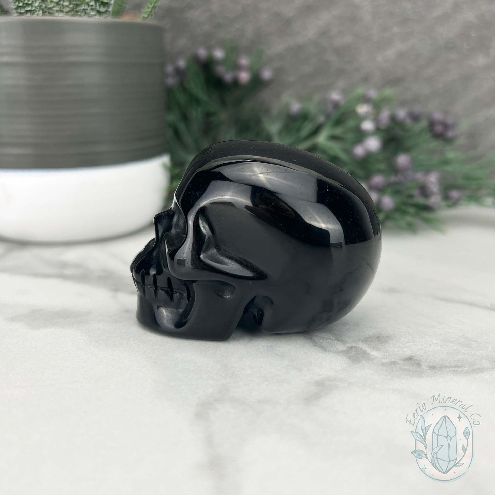 Polished Silver Obsidian Skull Carving