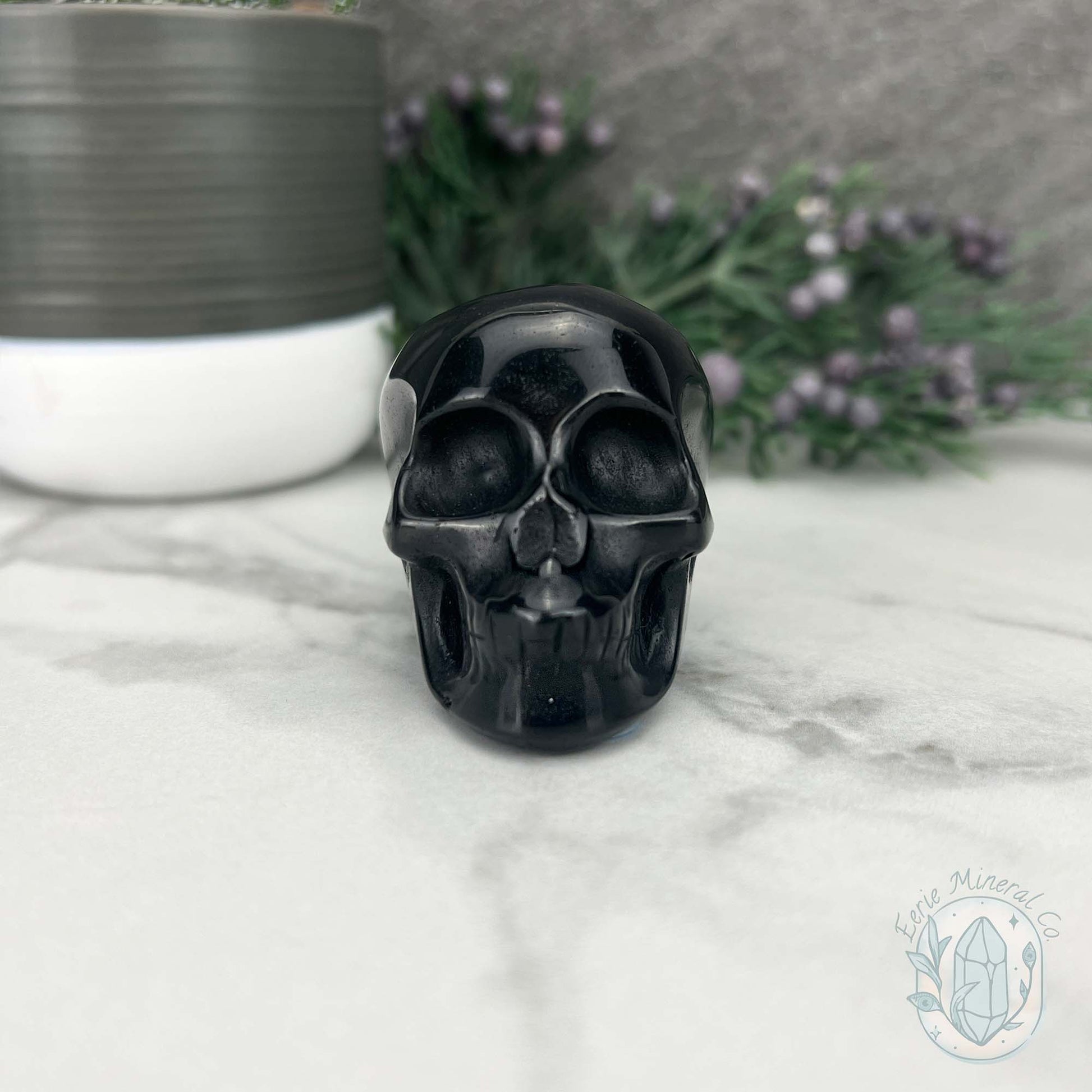 Polished Silver Sheen Obsidian Skull Carving