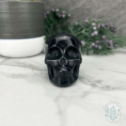 Polished Silver Sheen Obsidian Skull Carving