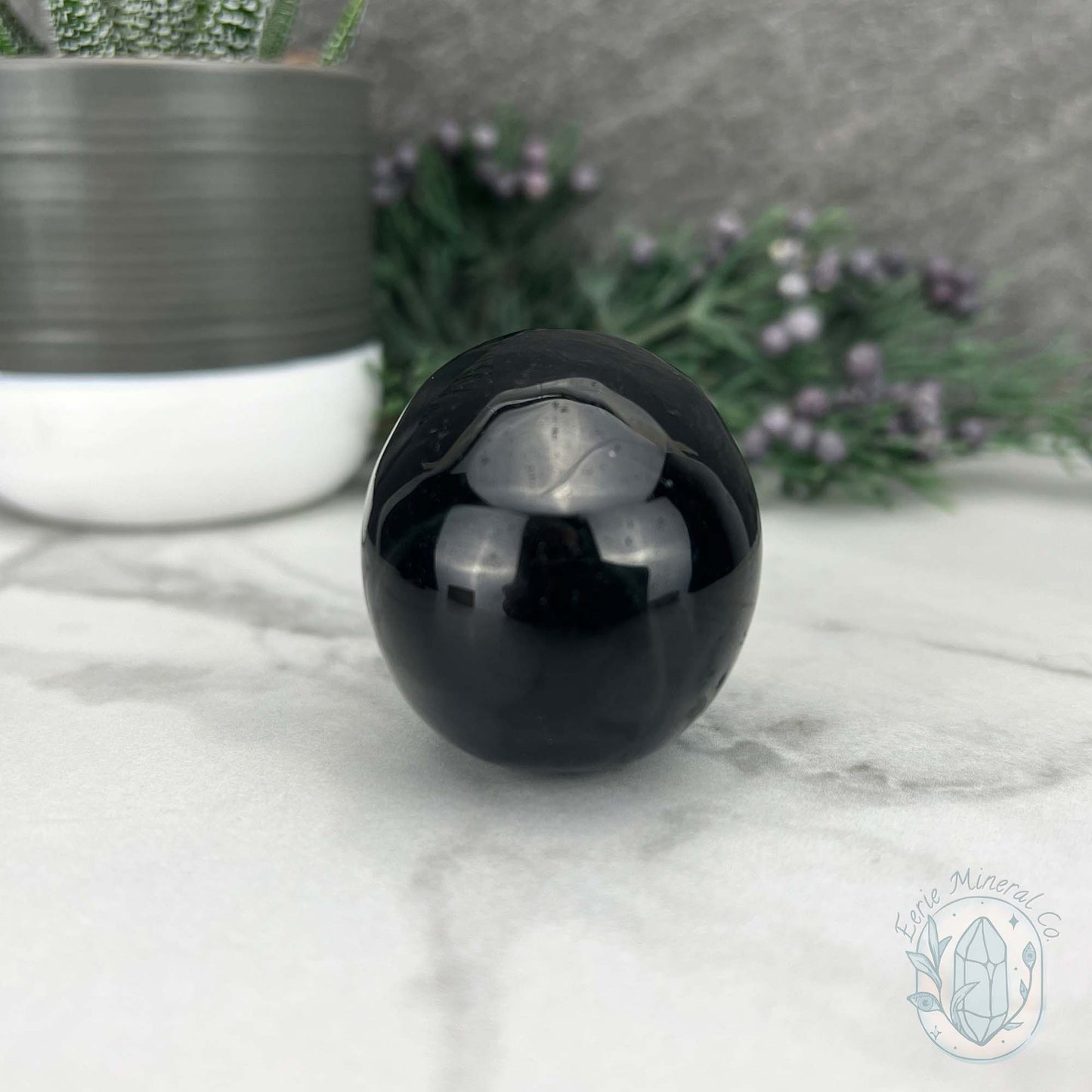 Polished Silver Sheen Obsidian Skull Carving