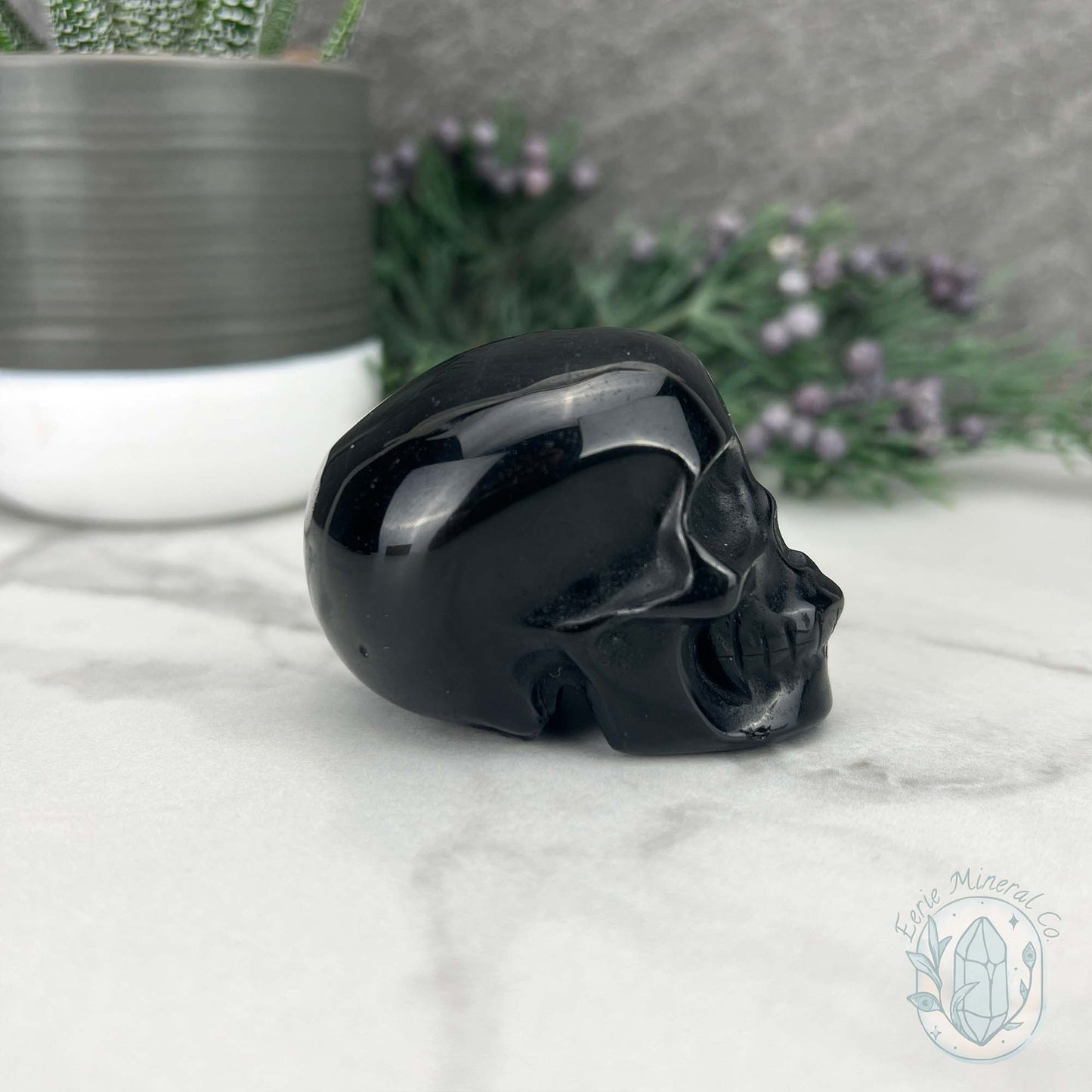 Polished Silver Sheen Obsidian Skull Carving
