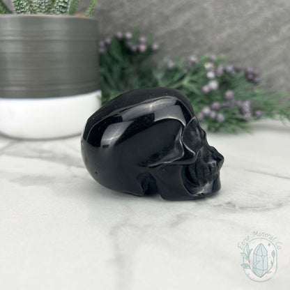 Polished Silver Sheen Obsidian Skull Carving
