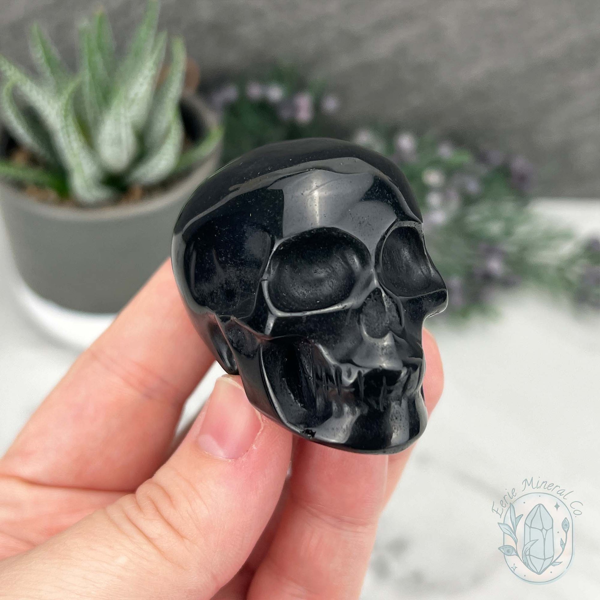 Polished Silver Sheen Obsidian Skull Carving