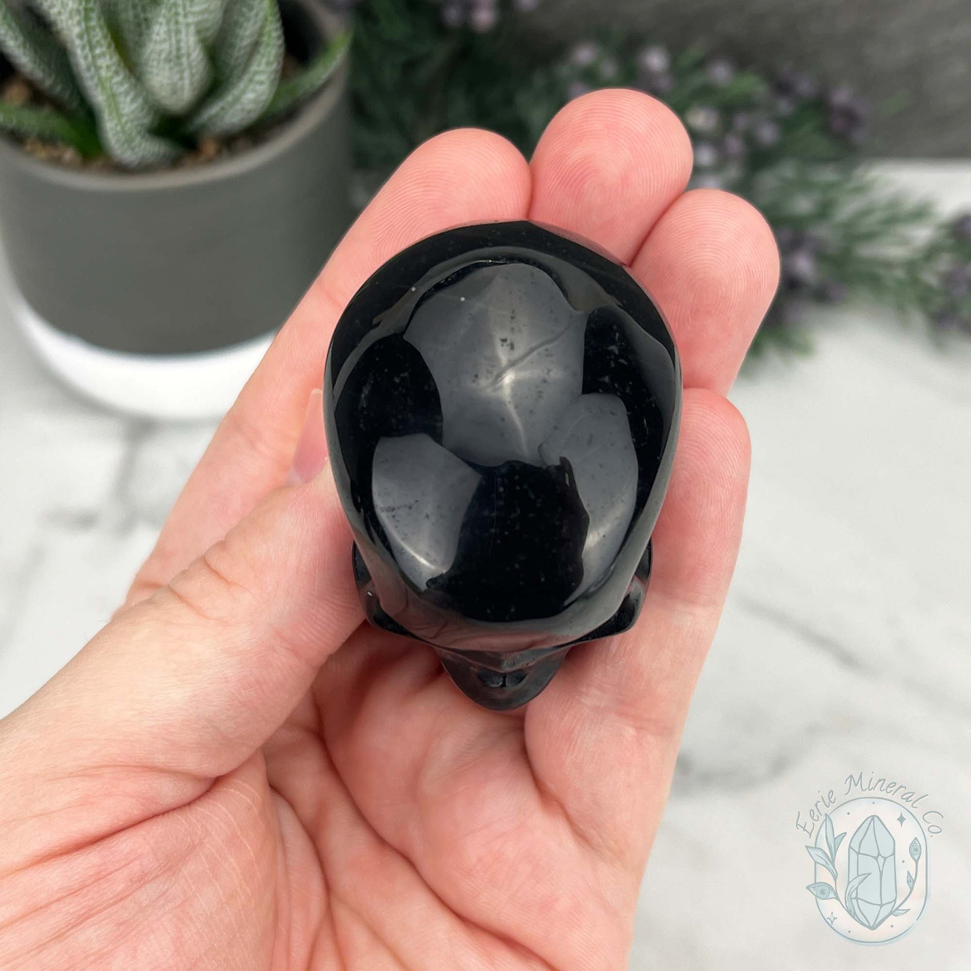 Polished Silver Sheen Obsidian Skull Carving