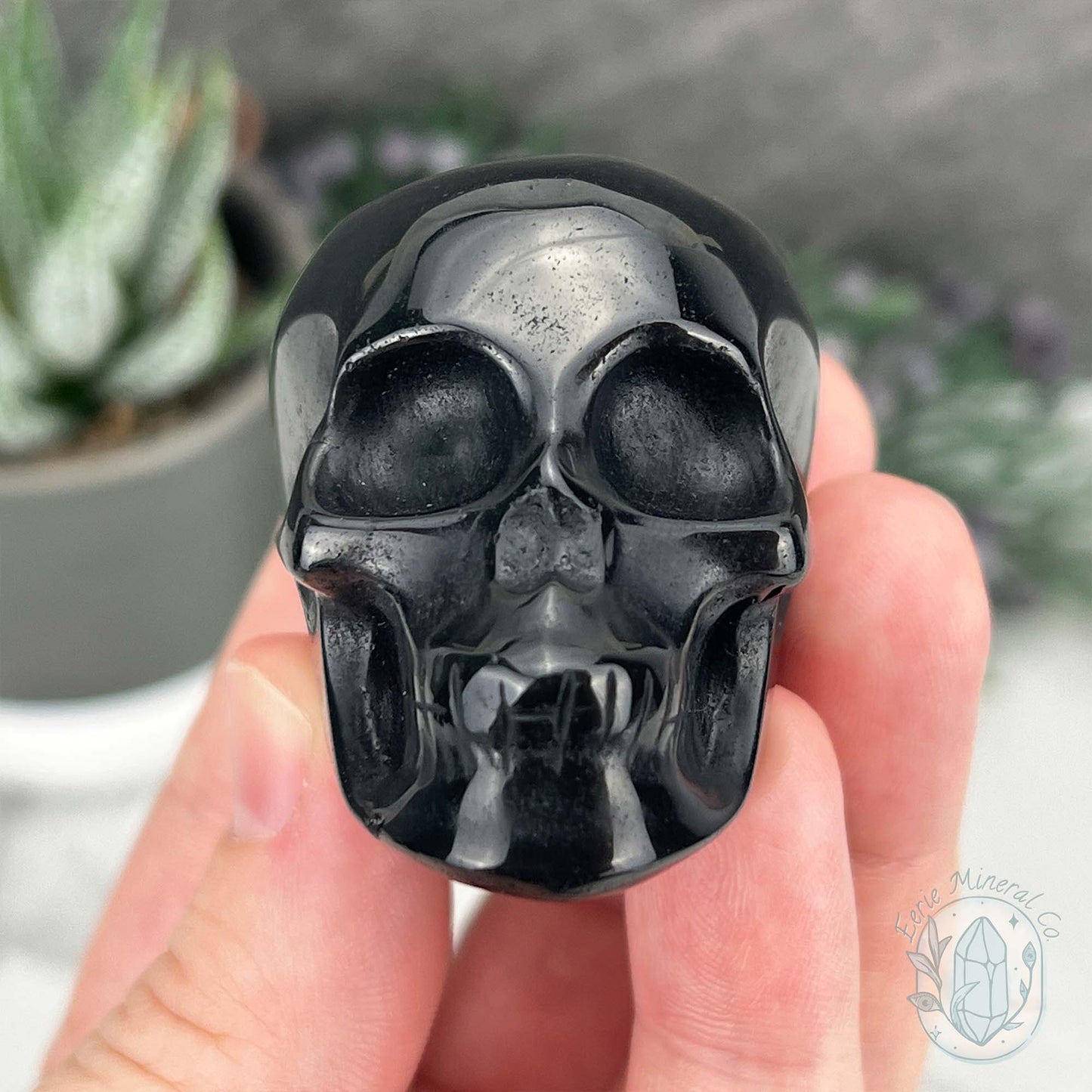 Polished Silver Sheen Obsidian Skull Carving